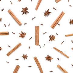 Set of cinnamon, clove and star anise, scattered in a chaotic manner, isolated on white background
