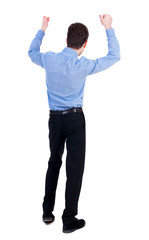 Back view of  man.  Raised his fist up in victory sign.   Rear view people collection.  backside view of person.  Isolated over white background. Businessman in blue shirt happily raised his hands.