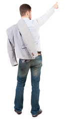 Back view of pointing business man.  Rear view people collection.  backside view of person.  Isolated over white background. Businessman throwing his jacket over his shoulder is pointing upward.