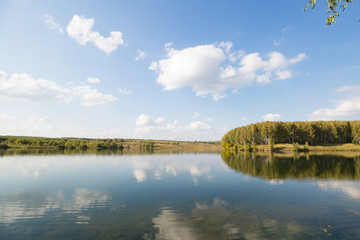Obraz na płótnie Canvas Calm clear lake in the woods. Autumn, september landscape