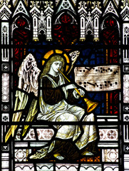 Angel making music (stained glass)