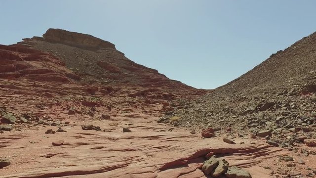 Land of the desert closeup.Red sand,cracks in the ground.Steady shot