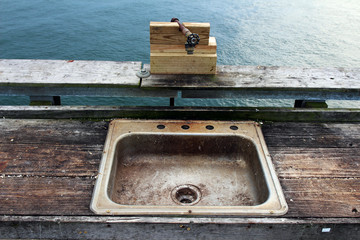 A public fish cleaning station on the pier at the Chesapeake Bay Bridge-Tunnel, Virginia Beach, USA