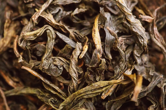 dried tea leaves closeup as background