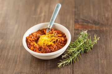 A Hot Bowl Of Spicy Organic Vegetarian Chili With Melted Cheese