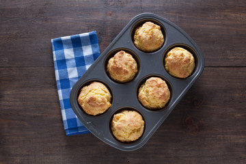 Corn Bread Muffins In Muffin Pan On Country Distressed Wood Tabl