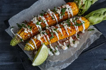 Zelfklevend Fotobehang Delicious Grilled Mexican Corn with Chili, Cilantro, and Lime © fazeful