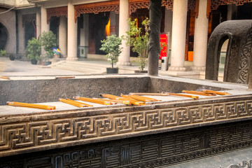 Fototapeta na wymiar Incense burning on a copper censer - Buddhist Temple - Shanghai, China