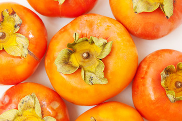 persimmons on a white table