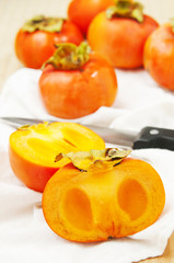 persimmons on a white table
