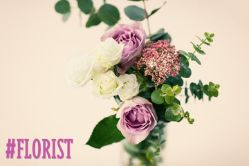 Bouquet of roses in vase on the white background