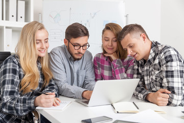 Fototapeta premium Colleagues watching entertaining video