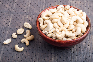 Selective focus on at the tasty and healthy raw cashew nuts