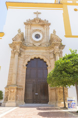 church facade with yellow trim in Marbella, Andalucia Spain