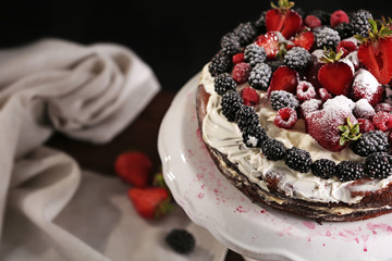 Appetizing cake decorated with berries