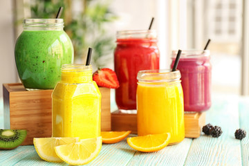 Refreshing fruit smoothie on table