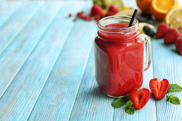 Refreshing fruit smoothie on table