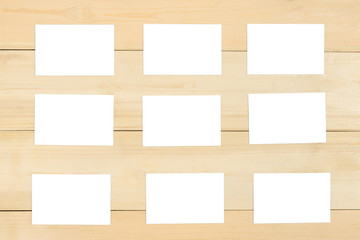 Set of blank business card top view on wooden background.