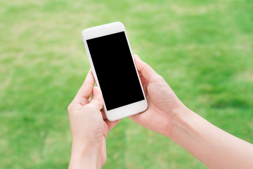 Hand holding blank mobile smart phone outdoor