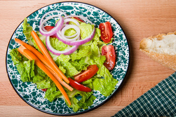 Fresh green salad with bread
