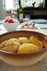 Breaded potatoes in ceramic bowl