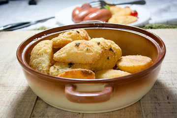 Fried sausages and breaded potatoes