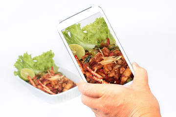 Spicy fried chicken in roasted chili sauce on selective focus.