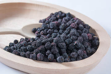 Aronia in wooden bowl