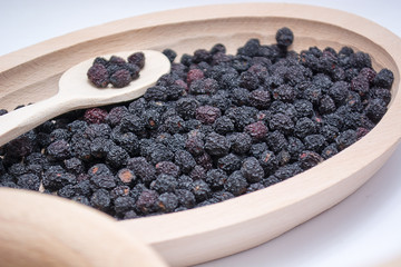 Aronia in wooden bowl