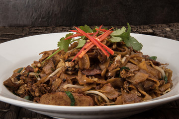Wok Fried noodles with soy sauce also known as char kway teow and is similar to pad thai