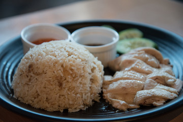 Hainan Chicken soft poached chicken with fragrant rice cucumber and chili sauce