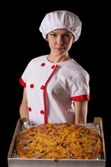 girl chef with pizza in hands