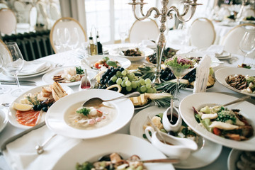 table with food and drink at restaurant before wedding party