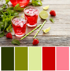 Fresh strawberry drink in glass with lime on wooden table with c