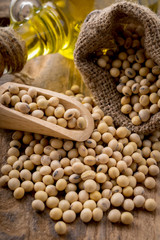 closeup is some soybeans with wooden spoon