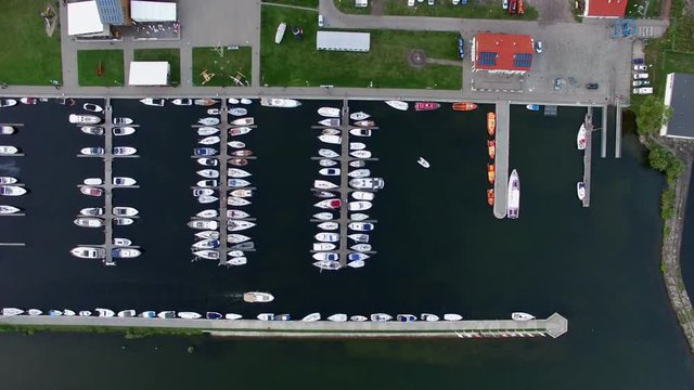 Aerial yachts in marina on lake vertical