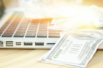 keyboard and money, a place for records, business plan, money background, hundred dollar bills front side.