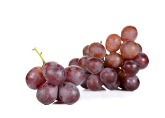 Fresh red grapes on white background