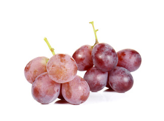 Fresh red grapes on white background