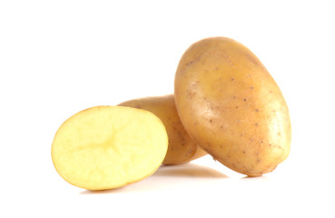 Fresh potatoes full ball and cut half on white background.