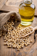 closeup is some soybeans with wooden spoon