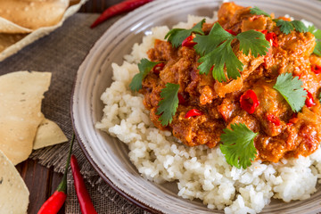 Chicken curry with rice and cilantro.