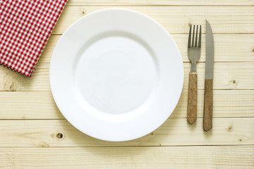 Empty Plate And Cutlery On The Wooden Table./Empty Plate And Cutlery On The Wooden Table 
