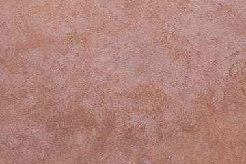 Fototapeta premium Brown painted stucco wall. Background texture