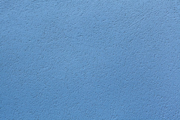 Blue painted stucco wall. Background texture