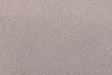 Beige painted stucco wall. Background texture