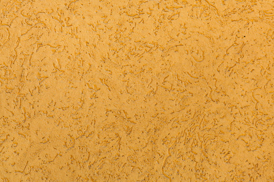 Yellow Ochre Painted Stucco Wall. Background Texture