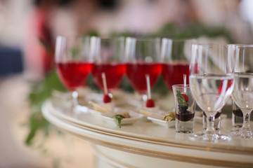 Festive buffet at the event with desert, champagne and wine. Soft focus