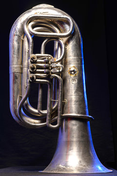 silver tuba isolated on black background