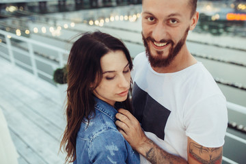 couple posing on the pier